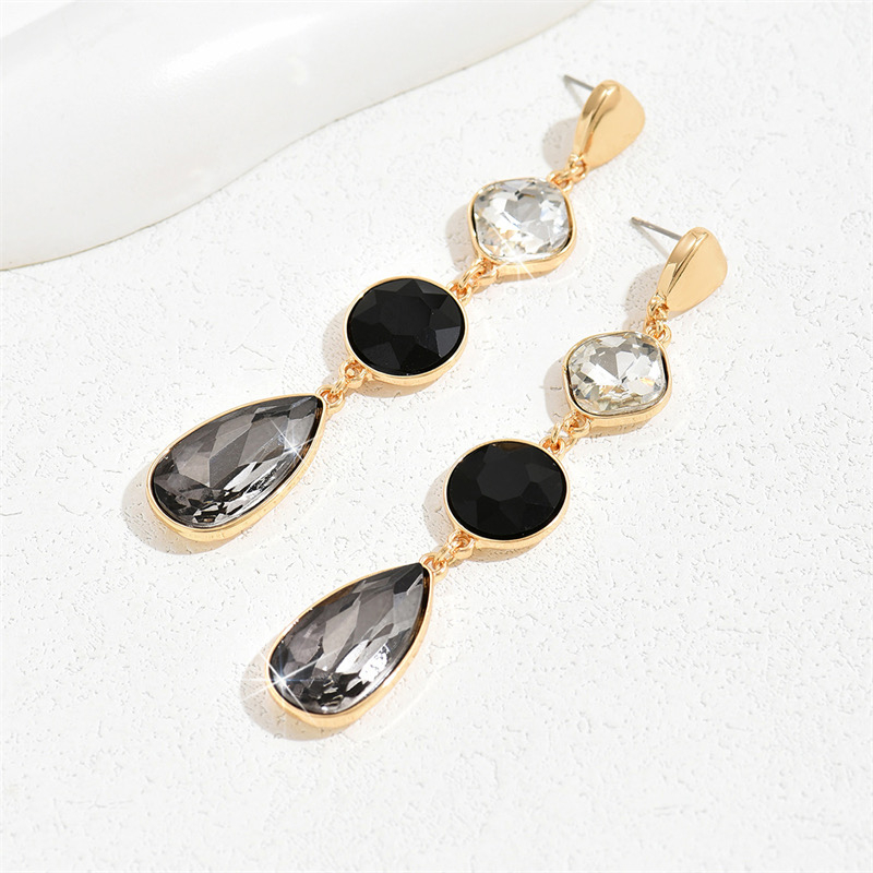 785-019543a2-3db4-763e-a5a9-e77043ccd6bf.jpg Aretes dorados/negro - Imagen 1